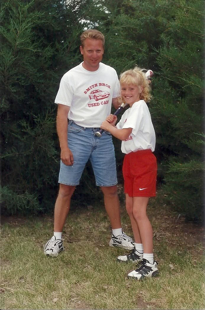 Cassi and her dad at softball